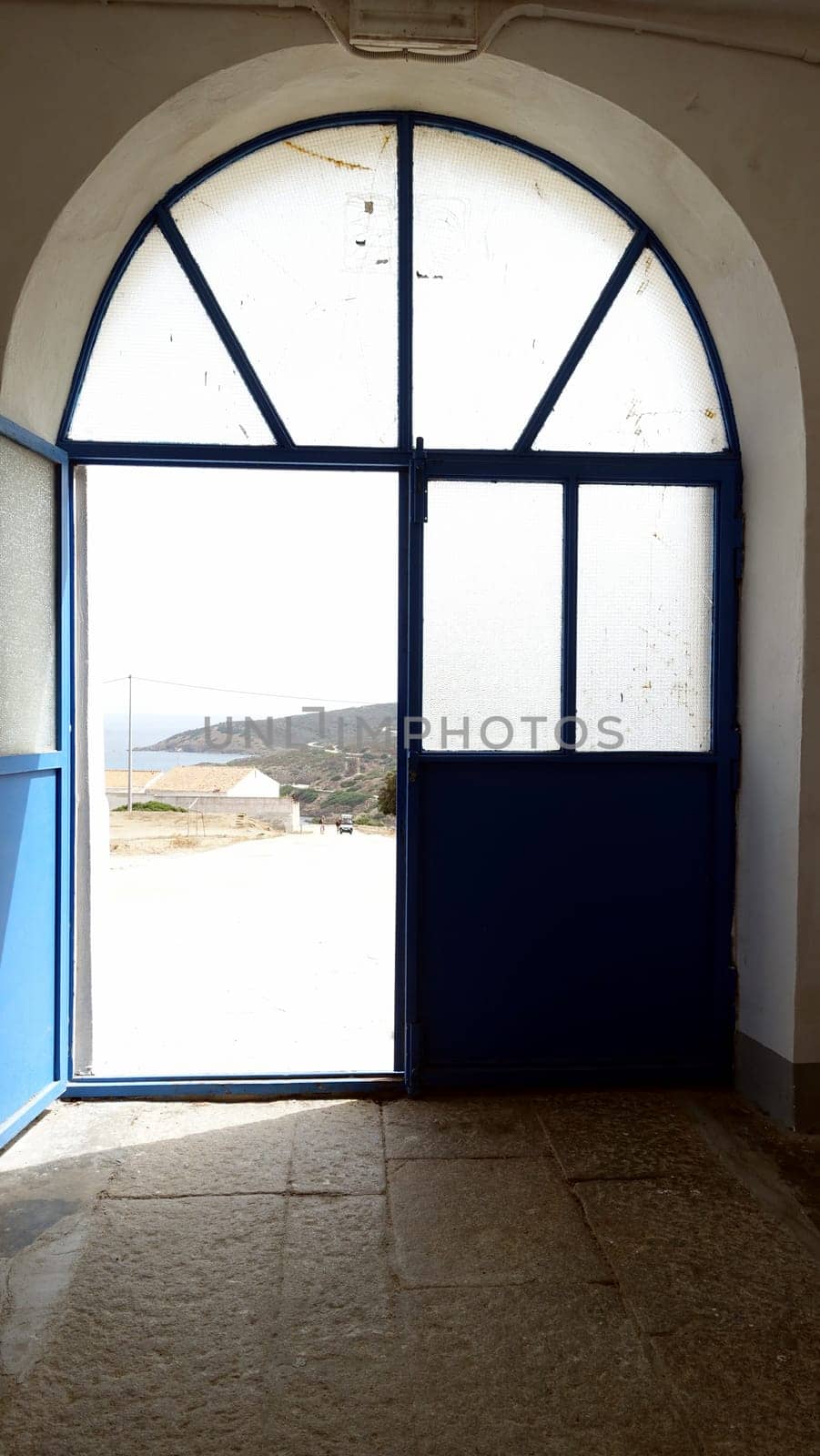 Asinara, Italy. August 11, 2021. The view of the sea from the door of the prison museum on the hill of the island.