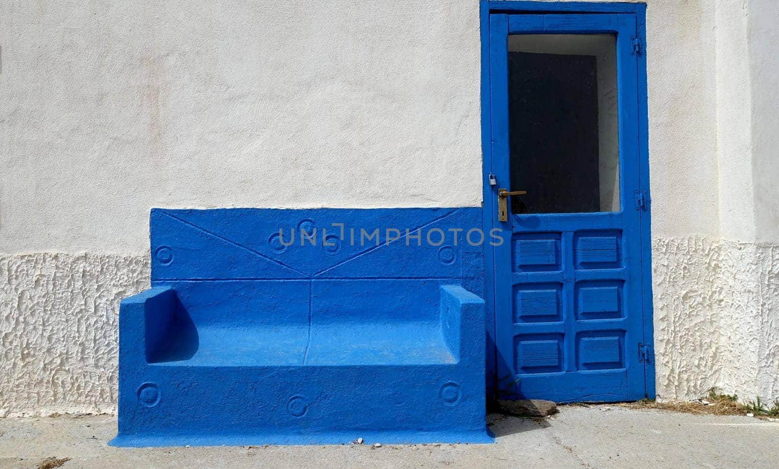 Asinara, Italy. August 11, 2021. Entrance with waiting sofa from the courtyard of the prison museum on the island hill.