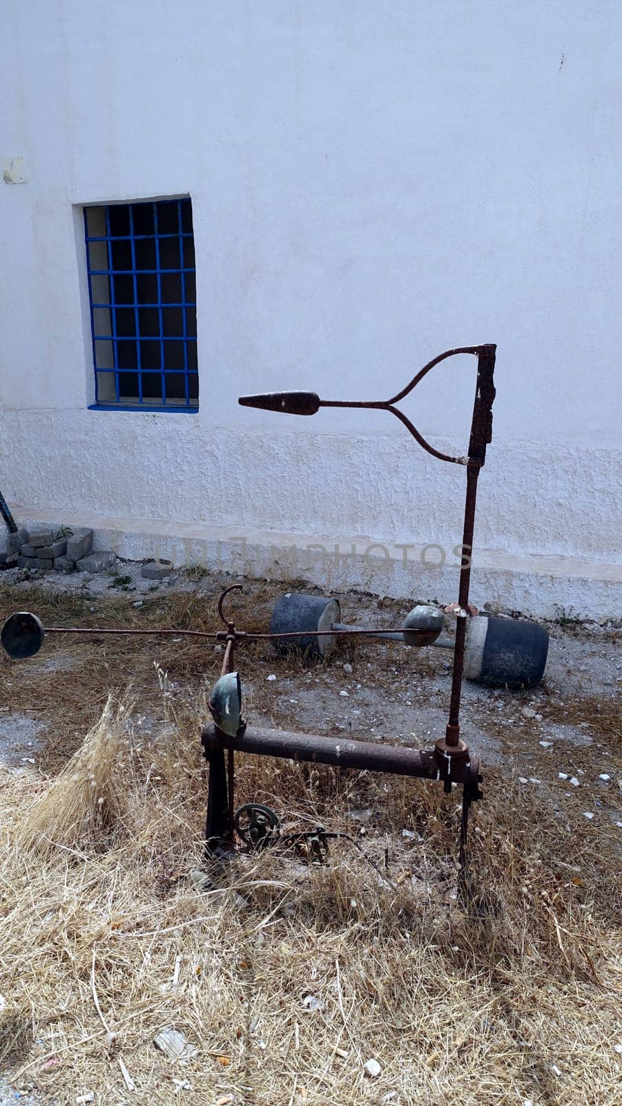Asinara, Italy. August 11, 2021. Ancient tools in the courtyard of the prison museum on the island hill.