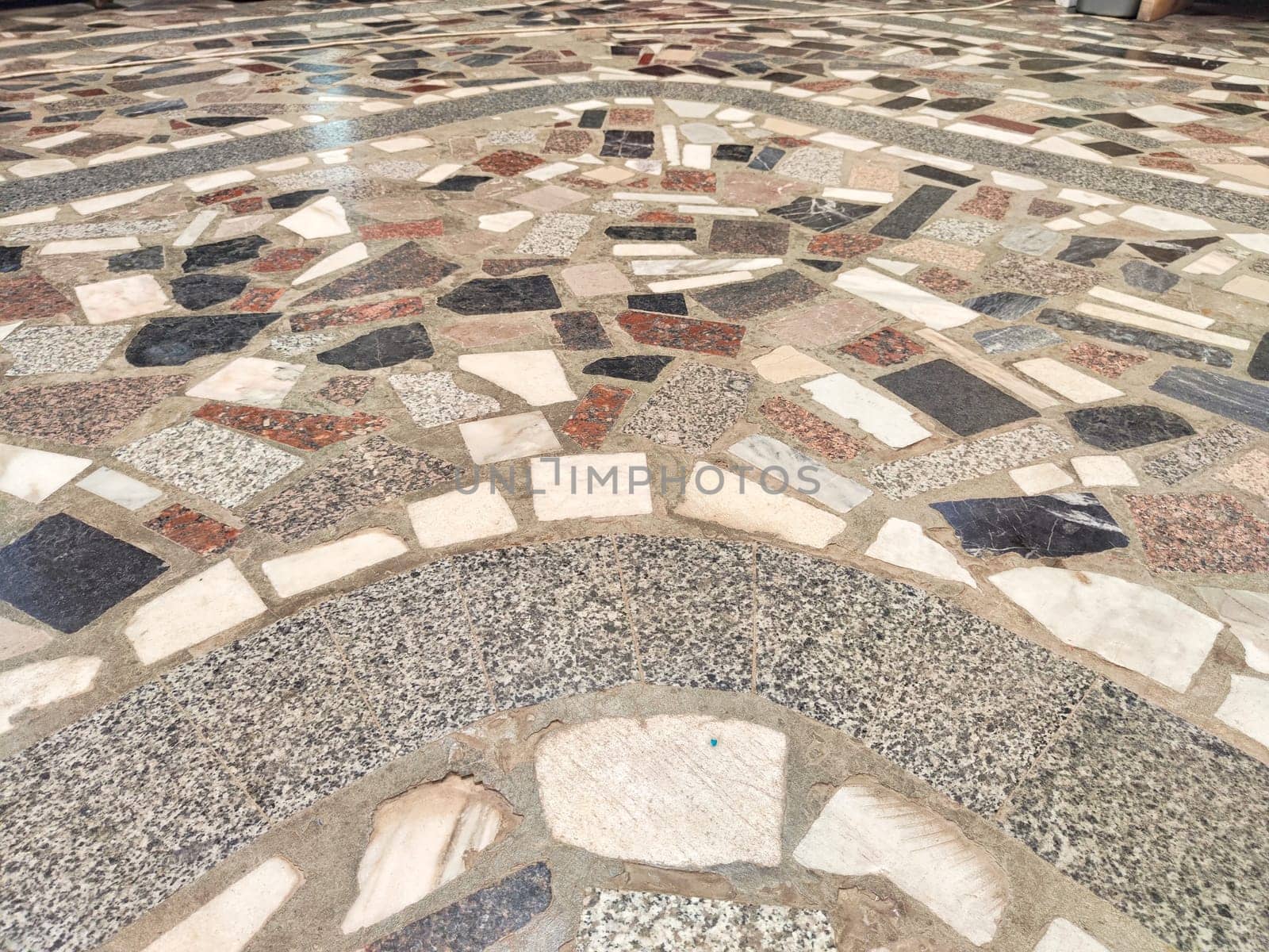 Variegated tiled surface demonstrating a complex pattern design. Background, texture, pattern, place for text