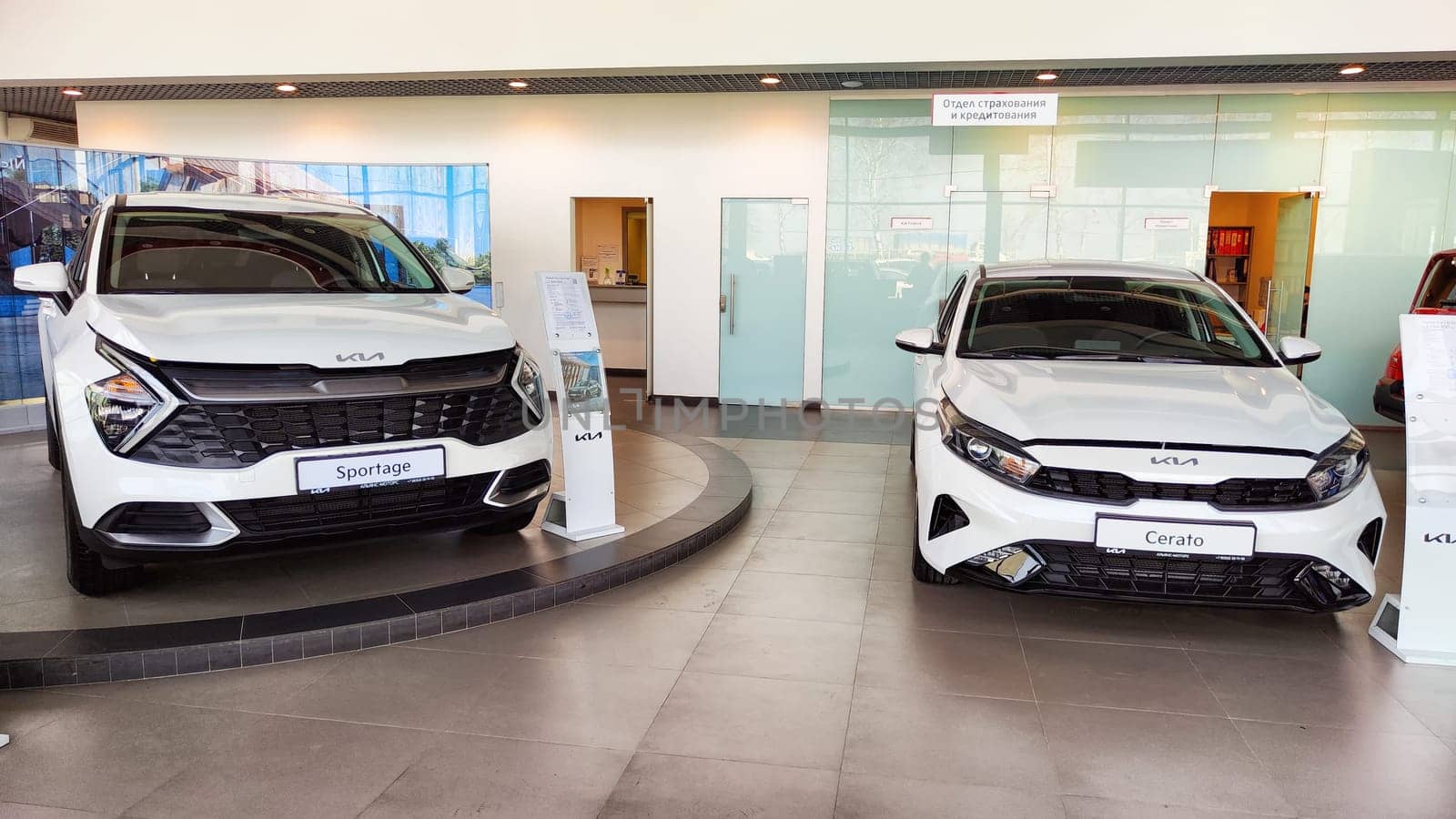 Cheboksary, Russia - April 05, 2023: Cars in showroom of dealership KIA. Re-export to Russia