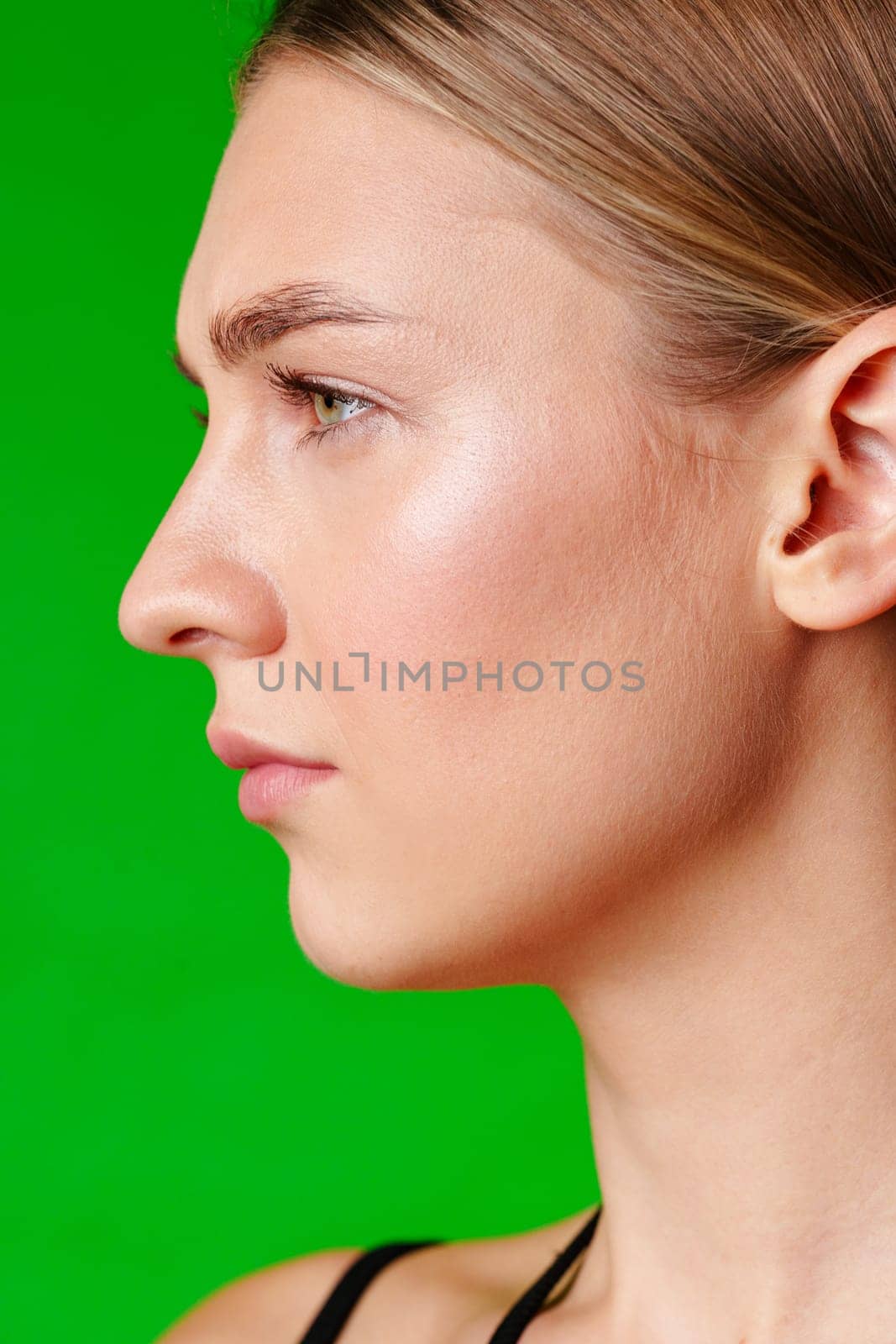 Close Up Portrait of Woman With Green Background in studio