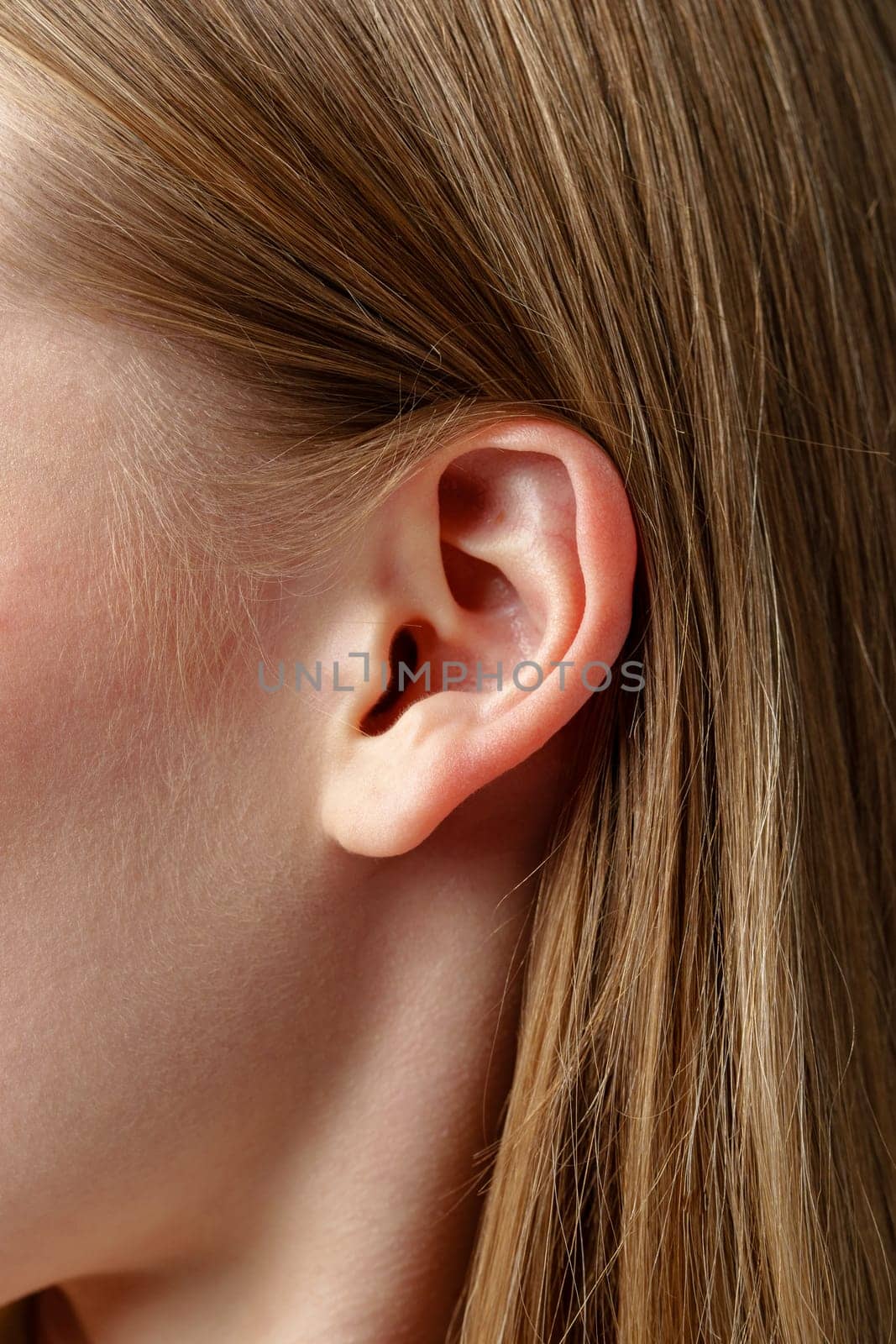 Close Up of Young Blonde Womans Ear by Fabrikasimf