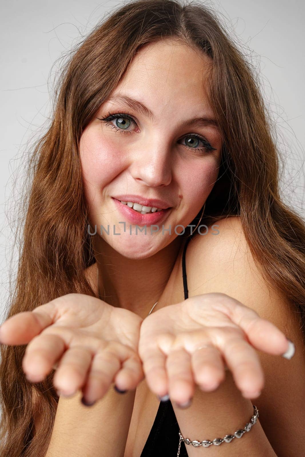 Woman With Long Red Hair Holding Hands Together and kissing by Fabrikasimf