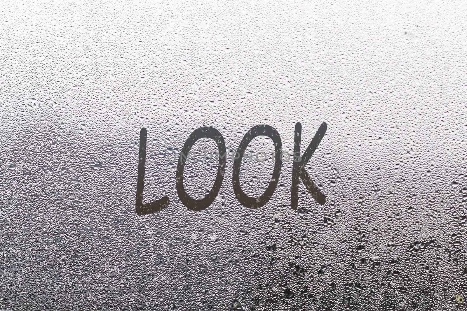 Handwritten lettering look on misted glass on window with raindrops, concept of full life and motivation.