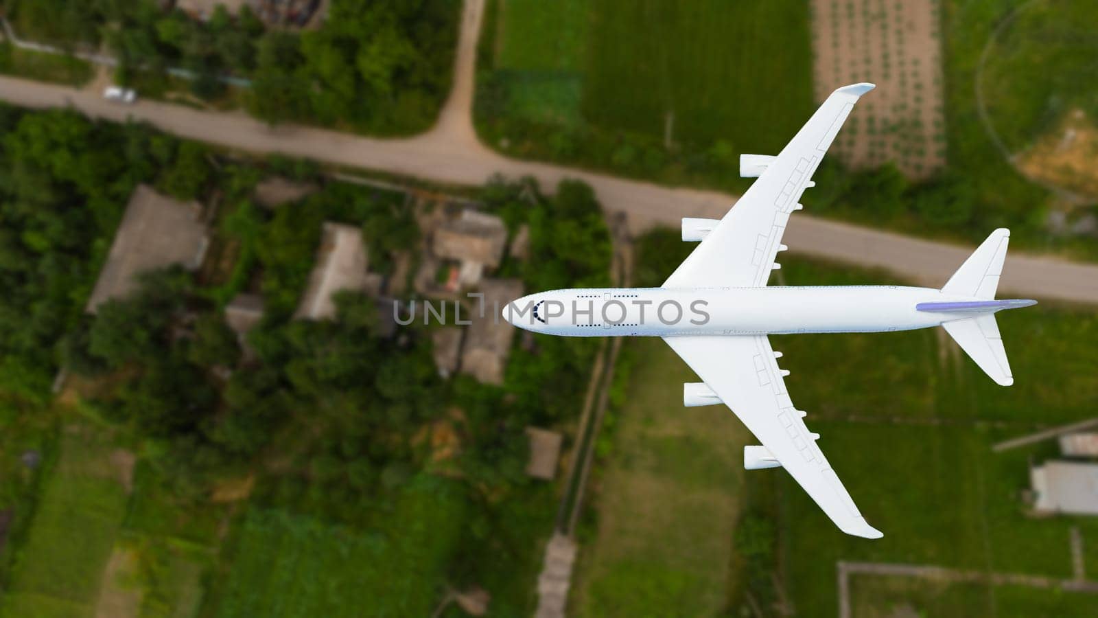 plane above the ground. Aerial city view.