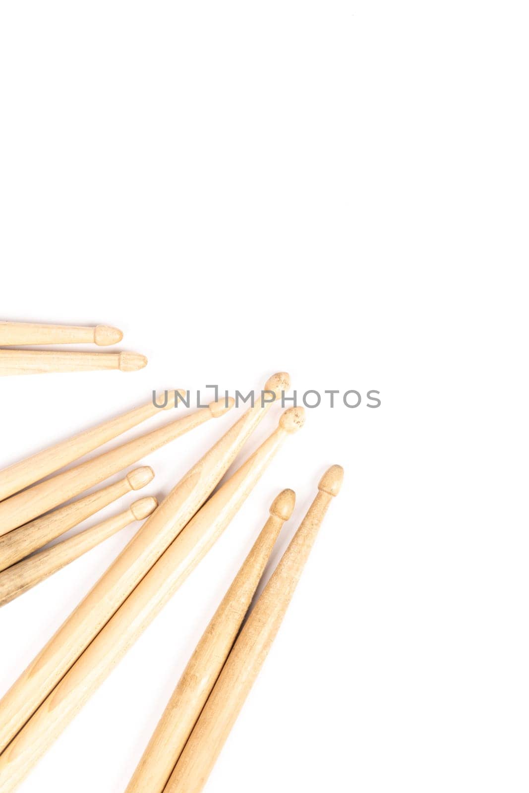 Drum sticks isolated on white background, copy space, vertical image by TropicalNinjaStudio