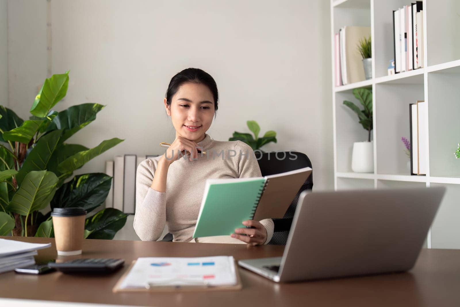 Beautiful asian young woman sit using computer laptop with relax smile. Freelance woman working online sale marketing. Shopping online at home.
