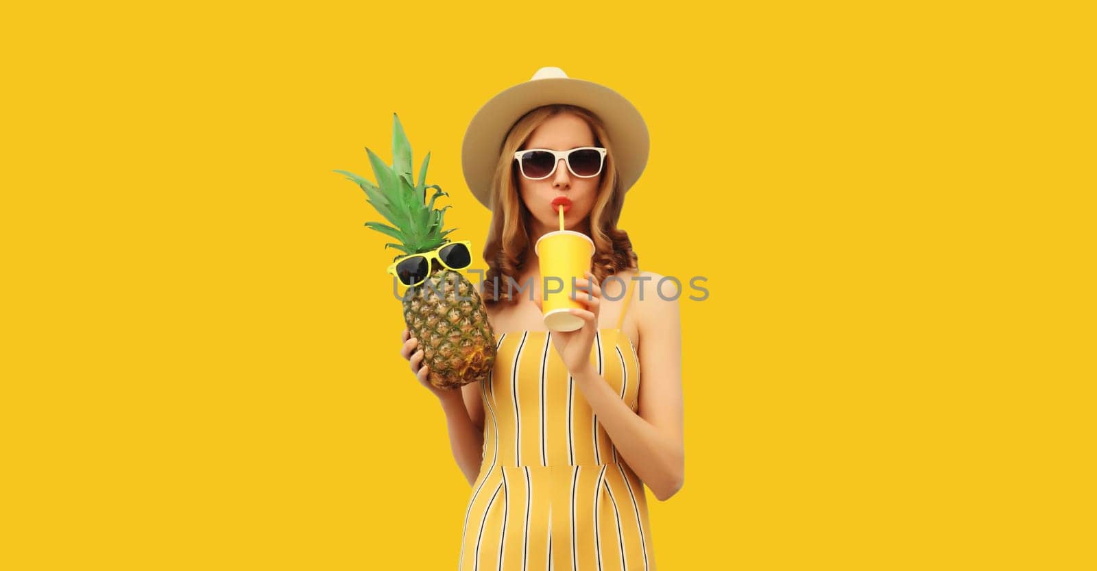 Summer portrait of stylish young woman drinking fresh juice with pineapple fruit by Rohappy