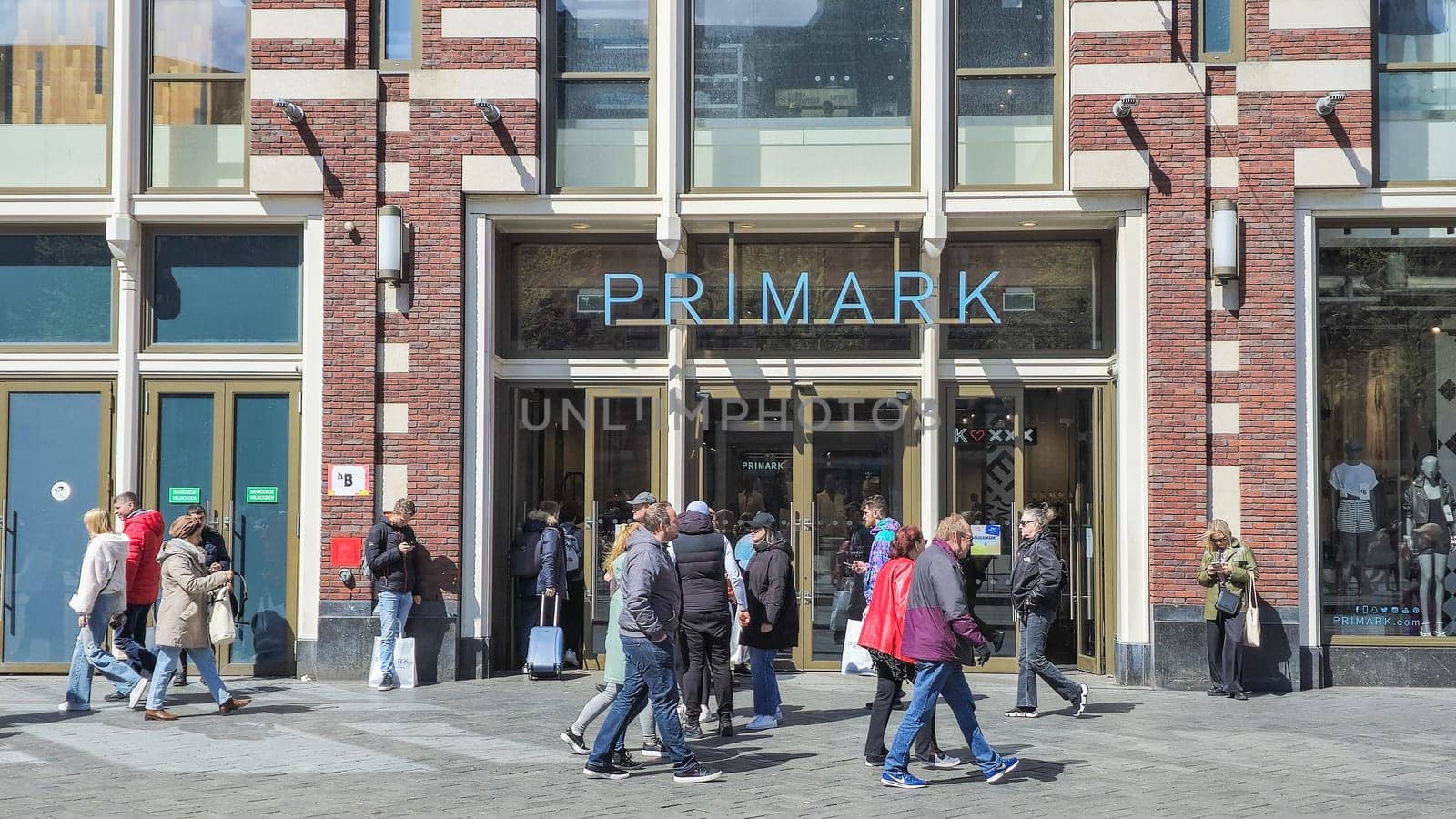 Amsterdam Netherlands 21 April 2024, Motion blur people walking shopping at the Primark shopping mall Amsterdam Primark Damrak