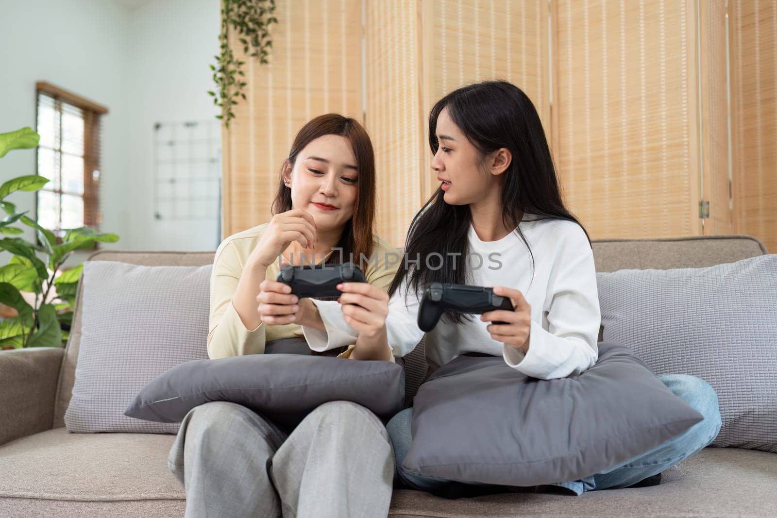 gay couple hug on sofa to relax together in healthy relationship love connection. Lgbtq couple concept.