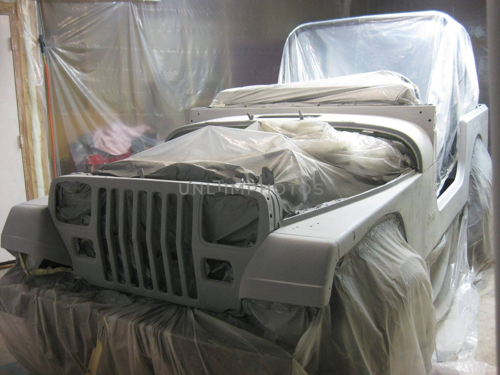 Preparing my SUV for Paint Job, Primer Gray, DIY 1990s Vehicle Restoration . High quality photo