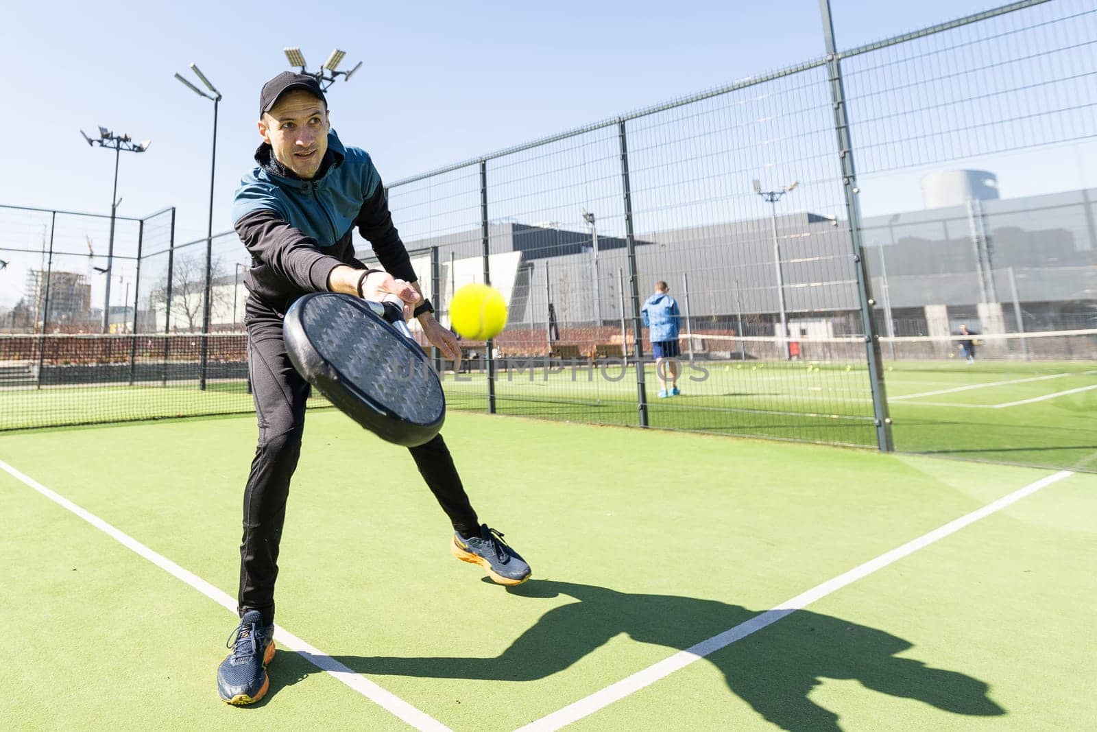 man playing paddle tennis at indoors pitch. High quality photo