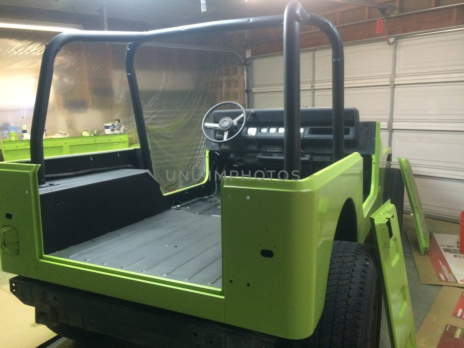 Fun DIY Lime Green Paint Job, Back of 1990s 4x4 Vehicle . High quality photo