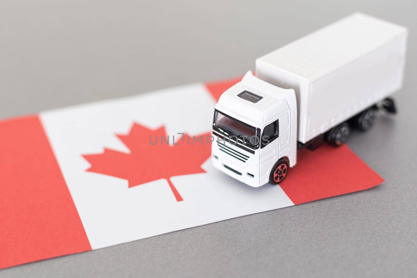 Symbol of National Delivery Truck with Flag of Canada. National Trucking Icon and Canadian flag by Andelov13