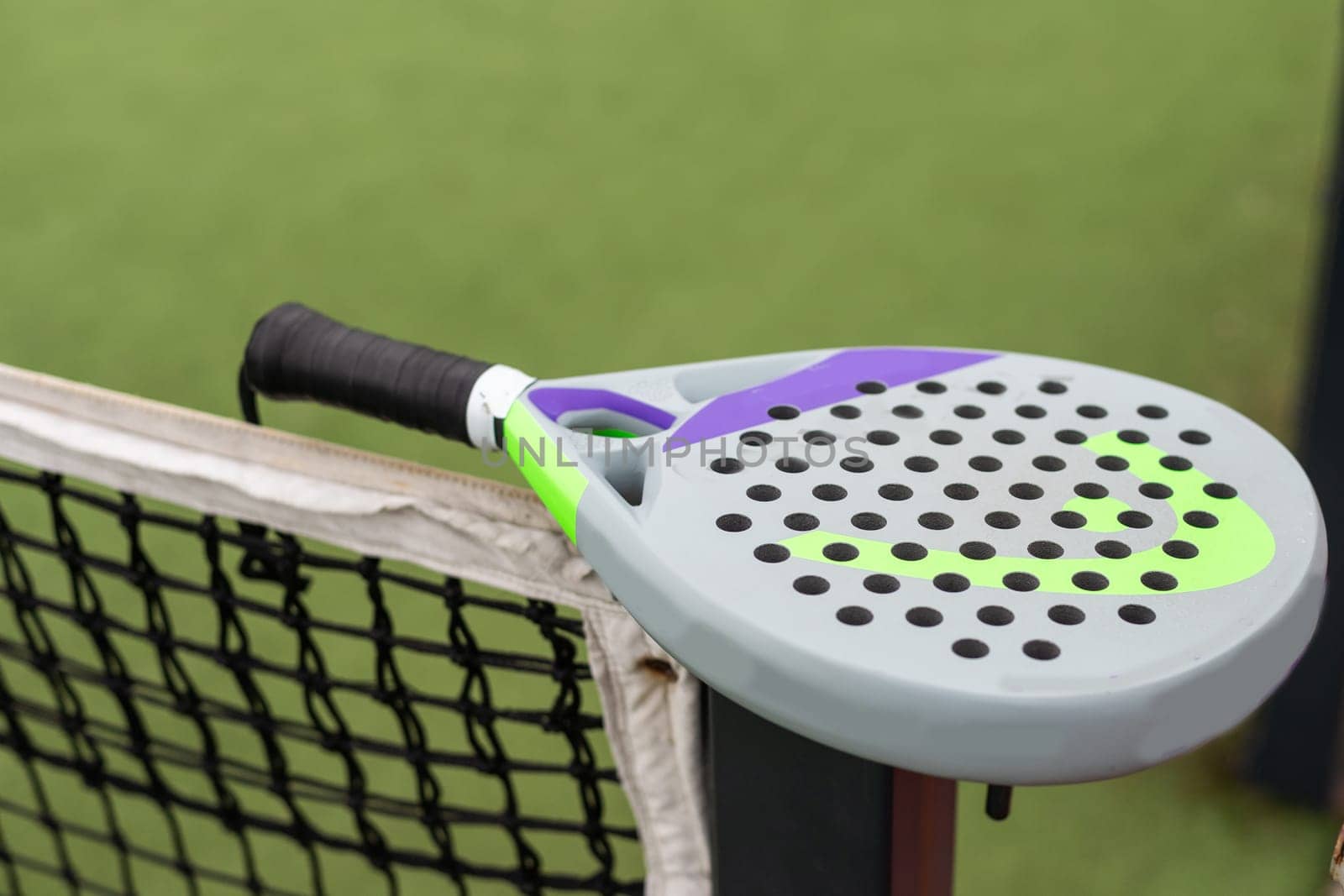 Paddle tennis racket and ball. High quality photo