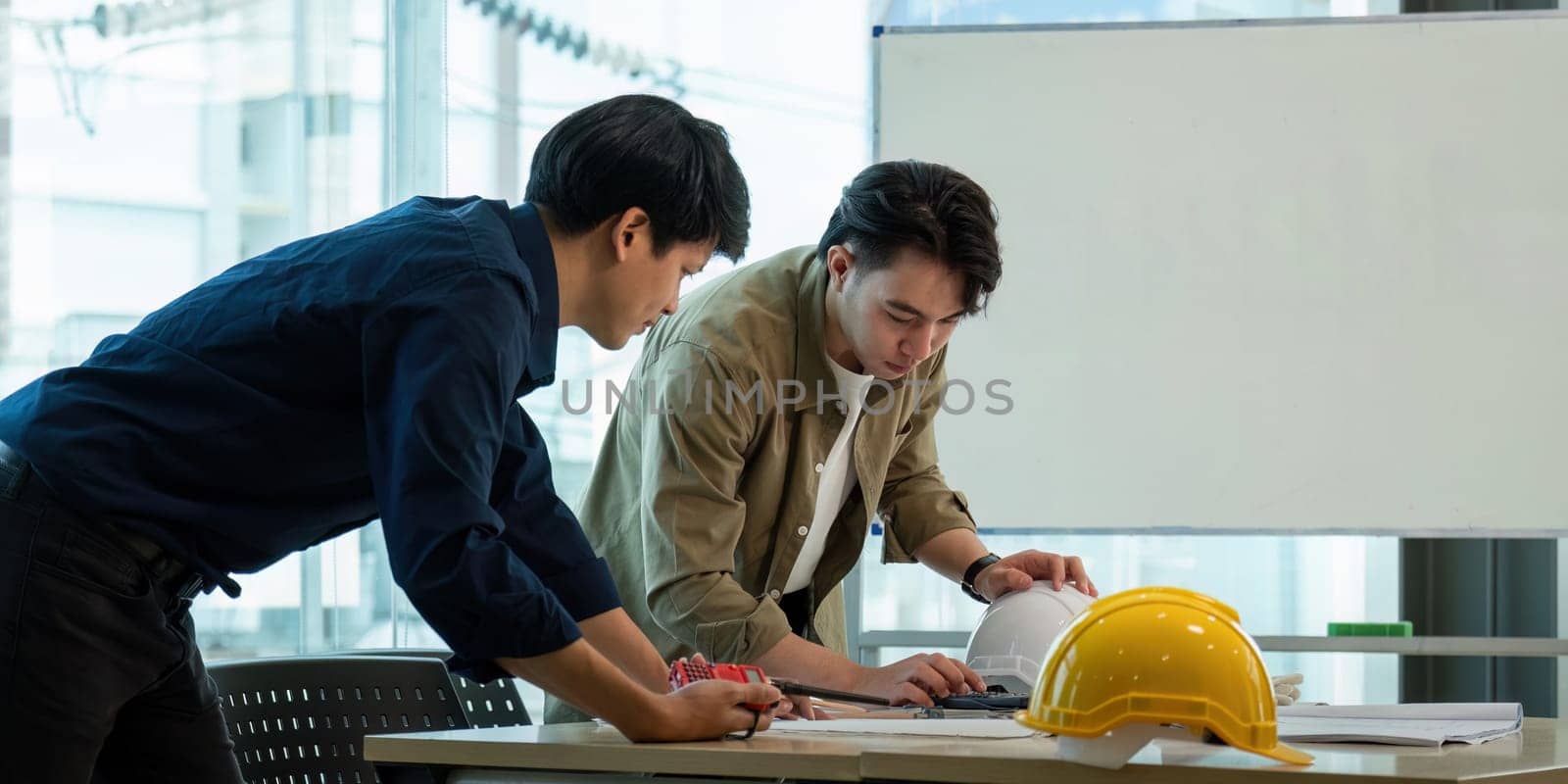 Construction and structure of engineer or architect meeting for project working with partner and tools on model building and blueprint in working site.