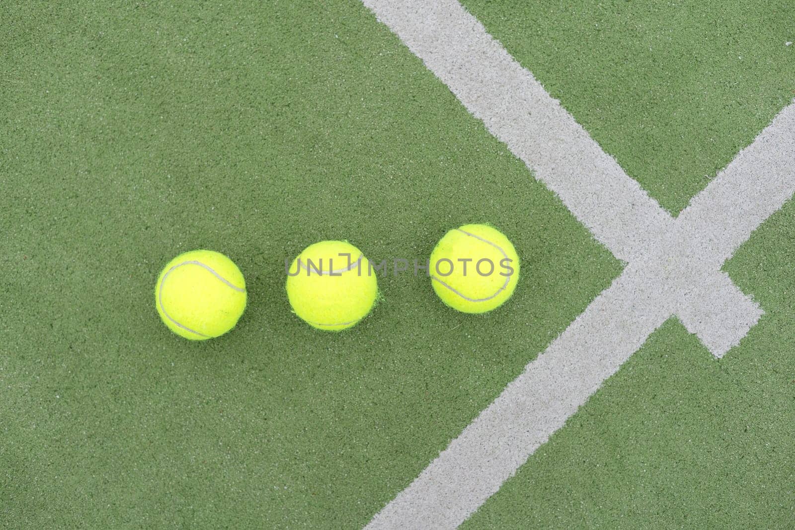 Tennis ball on green grass by Andelov13