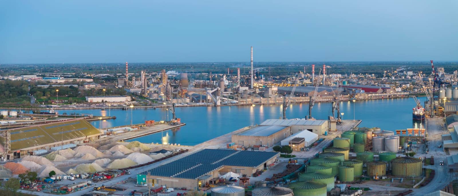 Aerial view of the industrial and port area of Ravenna ,chemical and petrochemical pole,thermoelectric,metallurgical plants and hydrocarbon refinery and liquefied natural gas tanks