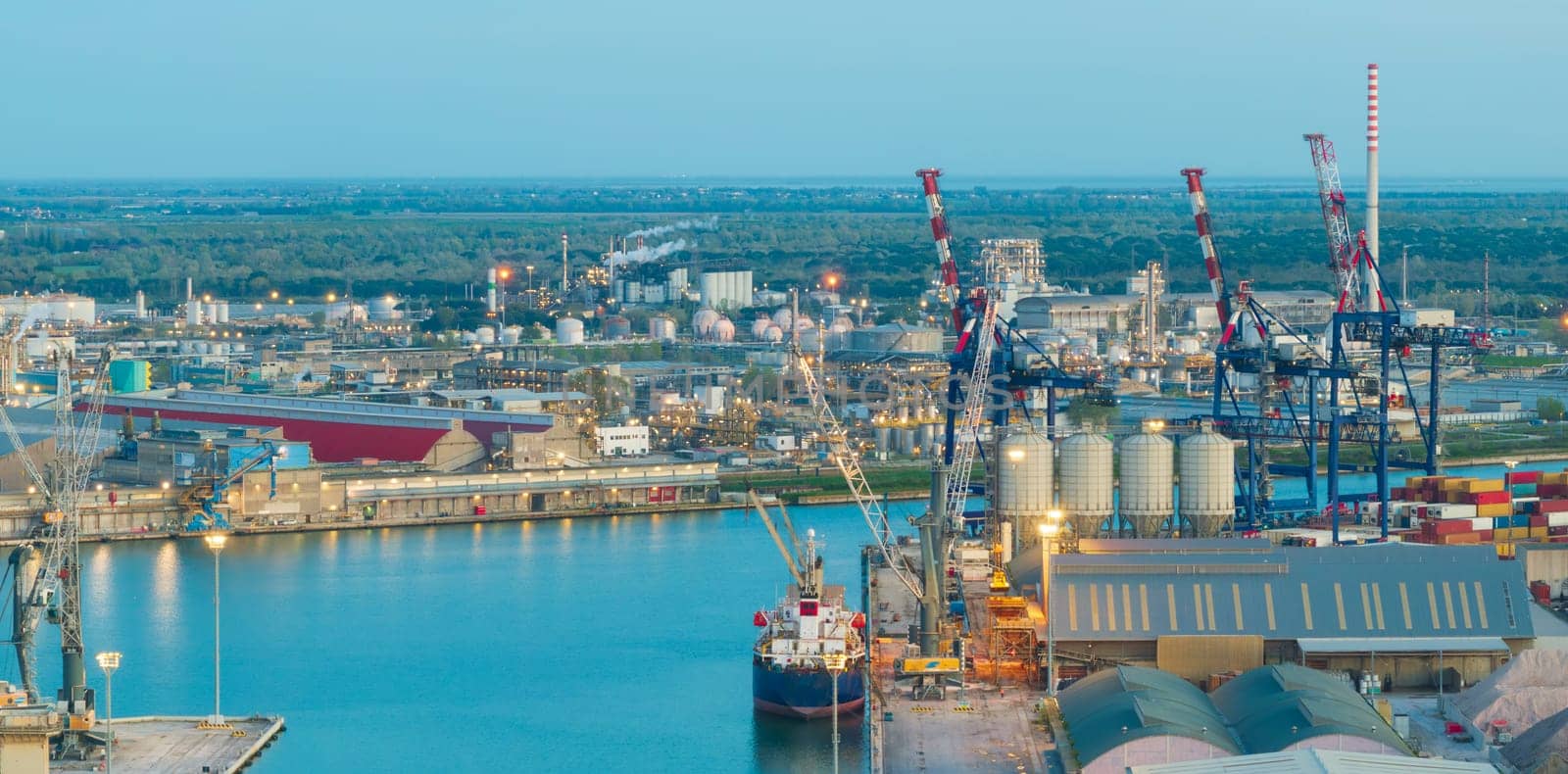 Aerial view of the industrial and port area of Ravenna ,chemical and petrochemical pole,thermoelectric,metallurgical plants and hydrocarbon refinery and liquefied natural gas tanks