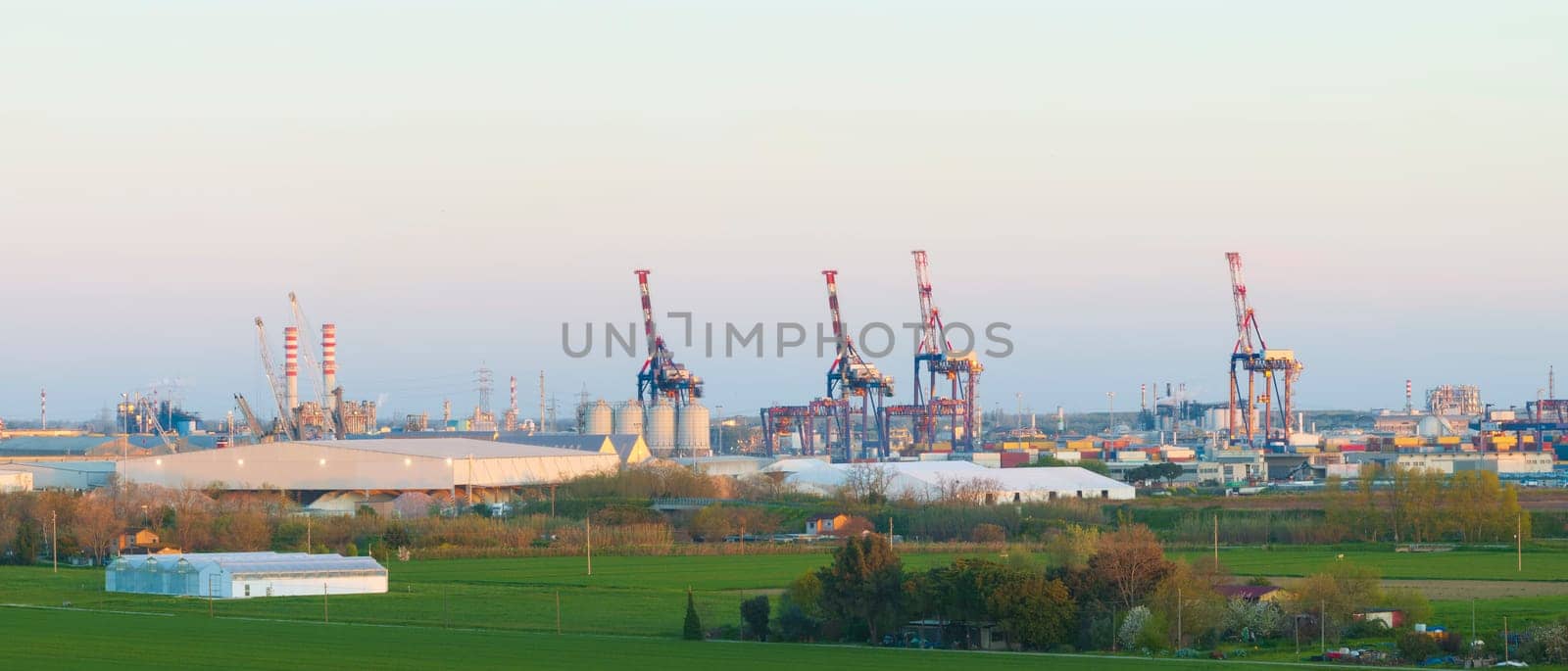 Aerial view of the industrial and port area of Ravenna ,chemical and petrochemical pole,thermoelectric,metallurgical plants and hydrocarbon refinery and liquefied natural gas tanks