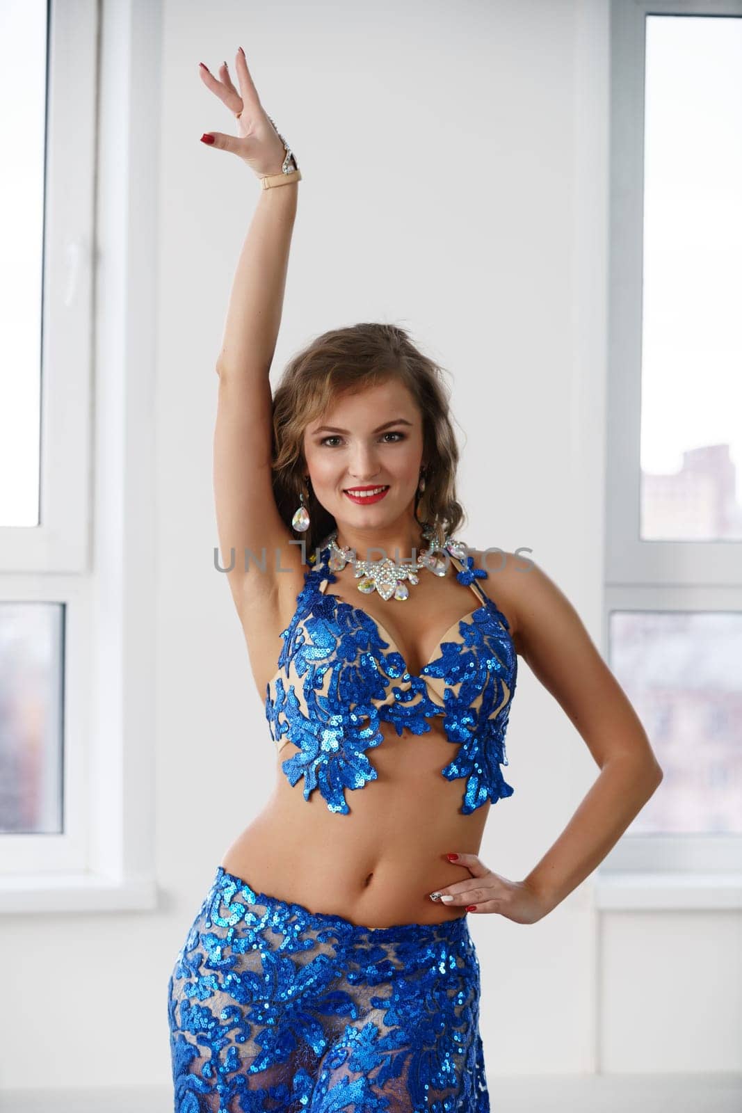 Belly dancer in costume embroidered with sequins by rivertime