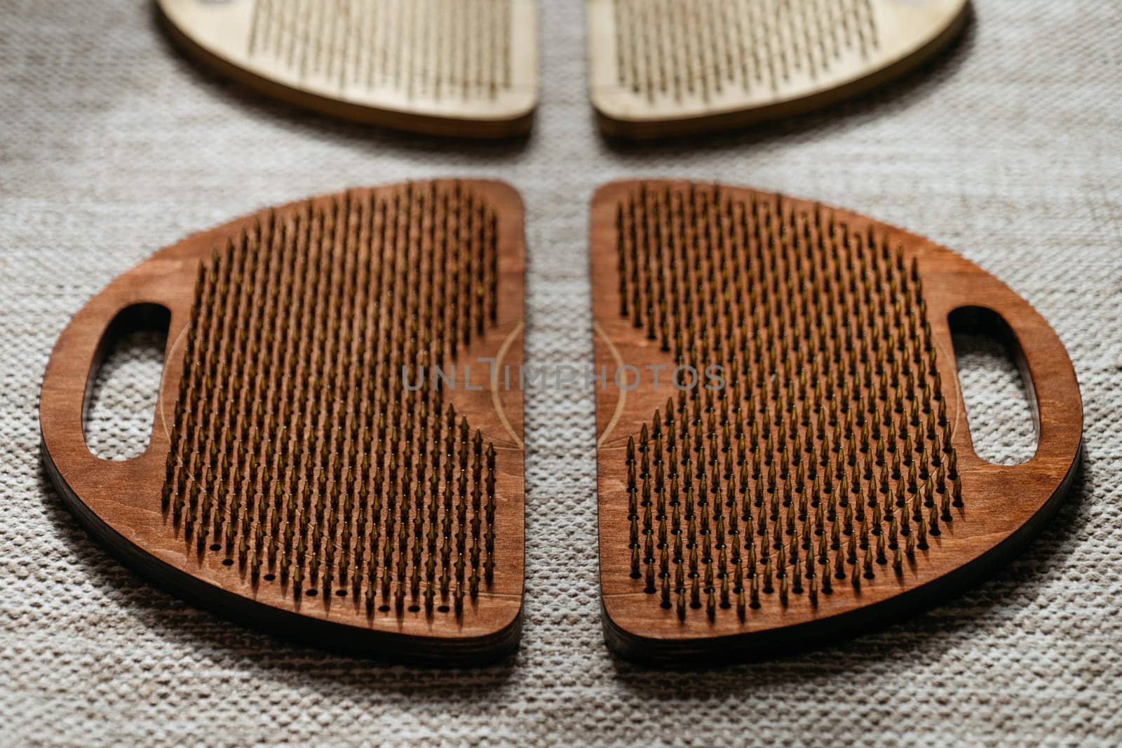 The interplay of light and shadow on sadhu boards, accentuating their textured surface.