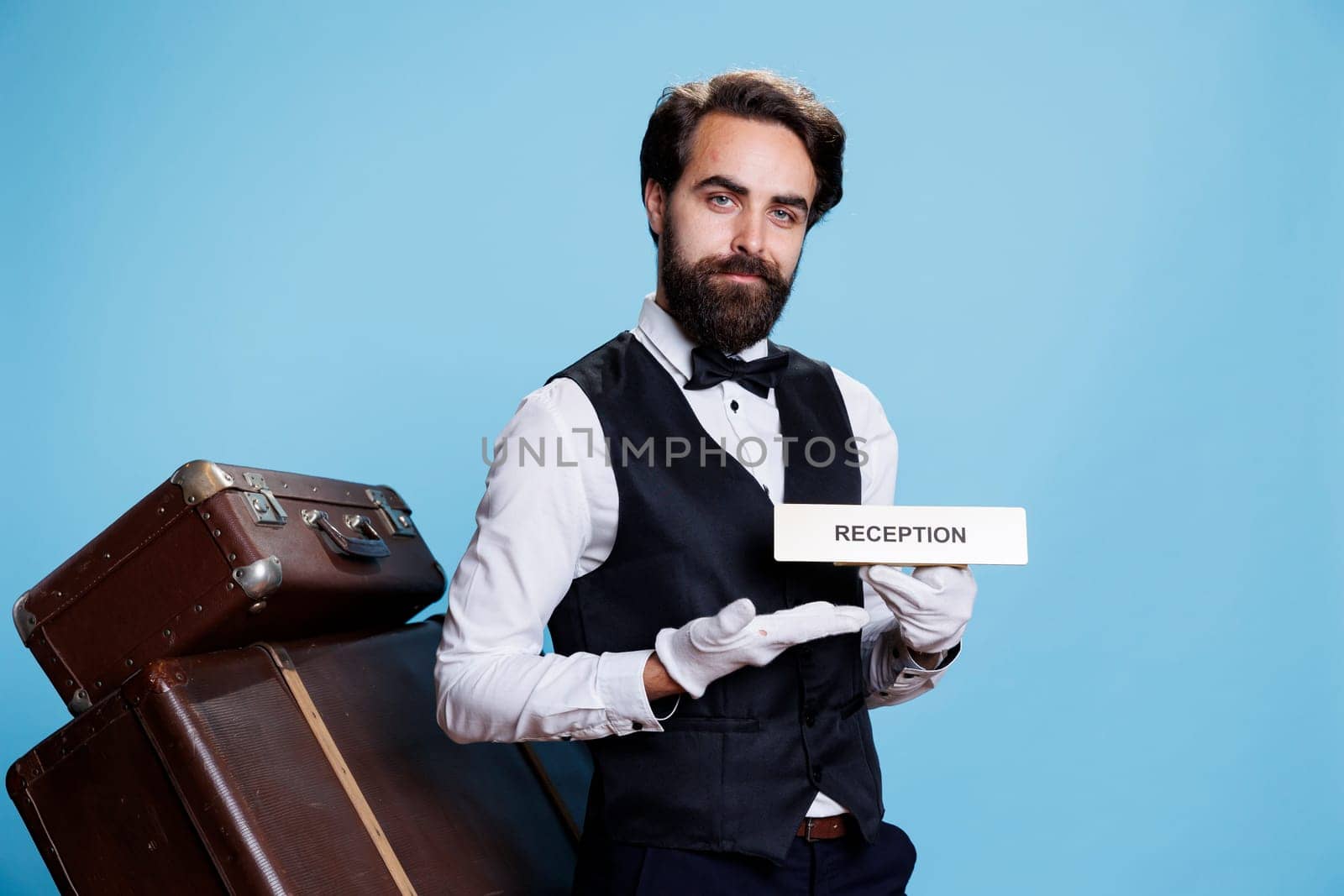 Doorman poses with sign of reception by DCStudio