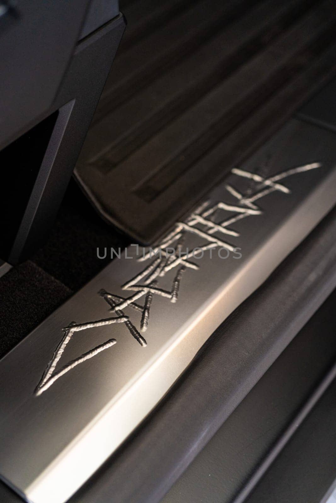 Close-Up of Tesla Cybertruck Signature Metal Engraving by arinahabich