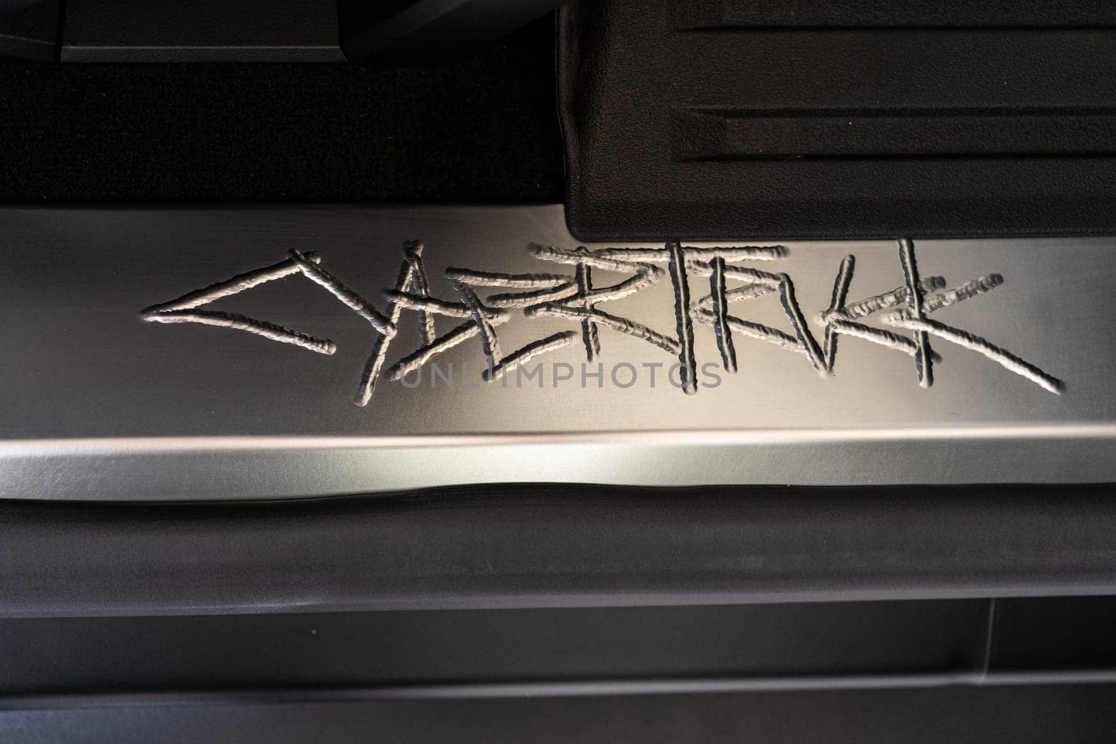 Close-Up of Tesla Cybertruck Signature Metal Engraving by arinahabich