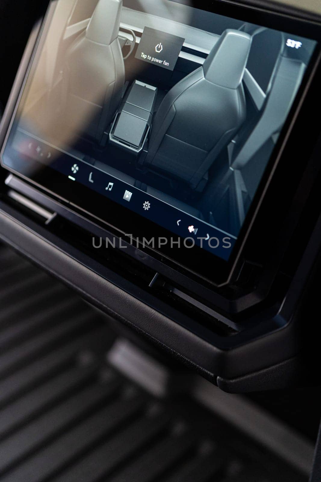 Denver, Colorado, USA-May 5, 2024-This image captures the sophisticated rear seat screen interface in the Tesla Cybertruck, highlighting the vehicle cutting-edge technology and user-friendly features, offering passengers control and comfort during their journey.