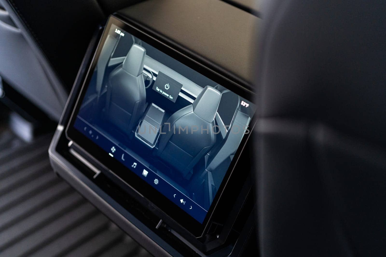 Denver, Colorado, USA-May 5, 2024-This image captures the sophisticated rear seat screen interface in the Tesla Cybertruck, highlighting the vehicle cutting-edge technology and user-friendly features, offering passengers control and comfort during their journey.