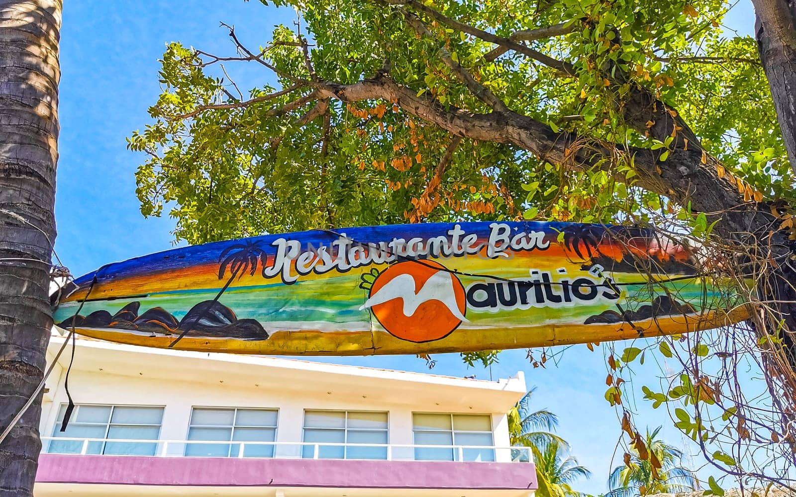 Advertising sign on surfboard surf board in Zicatela Puerto Escondido Oaxaca Mexico.