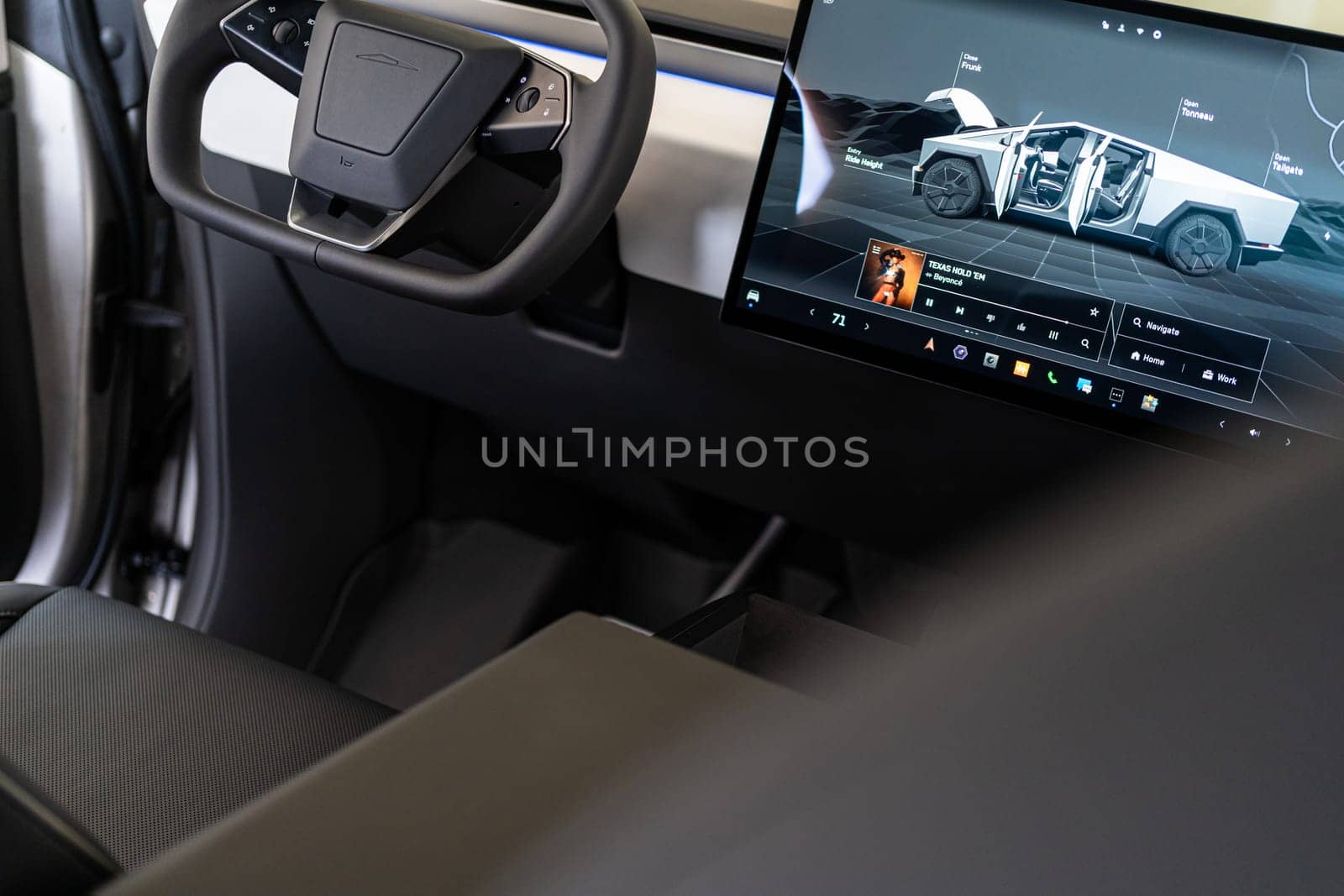 Interior view of a Tesla Cybertruck with touchscreen display by arinahabich