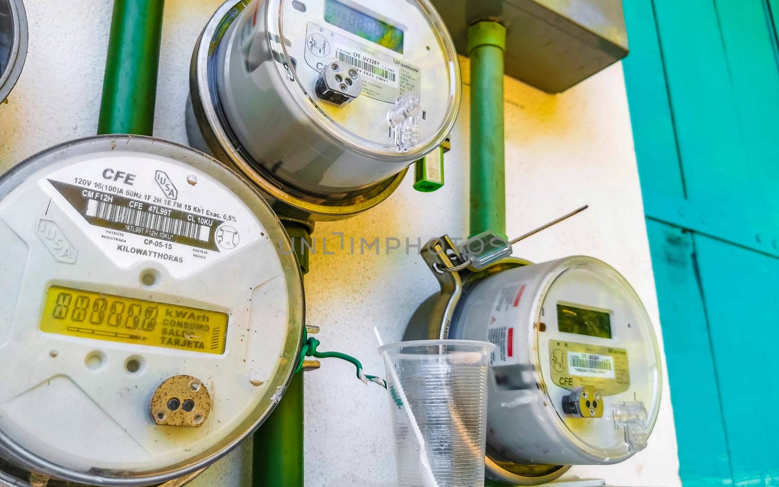 Old broken electricity meters on the wall in Zicatela Puerto Escondido Oaxaca Mexico.