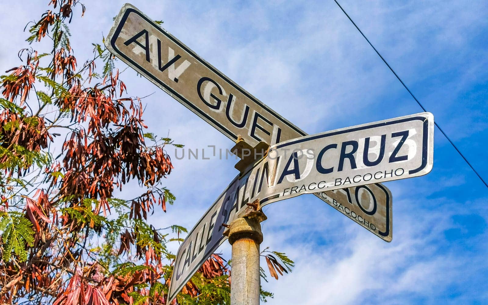 Blue and white road street signs and name for orientation of streets and roads in Zicatela Puerto Escondido Oaxaca Mexico.