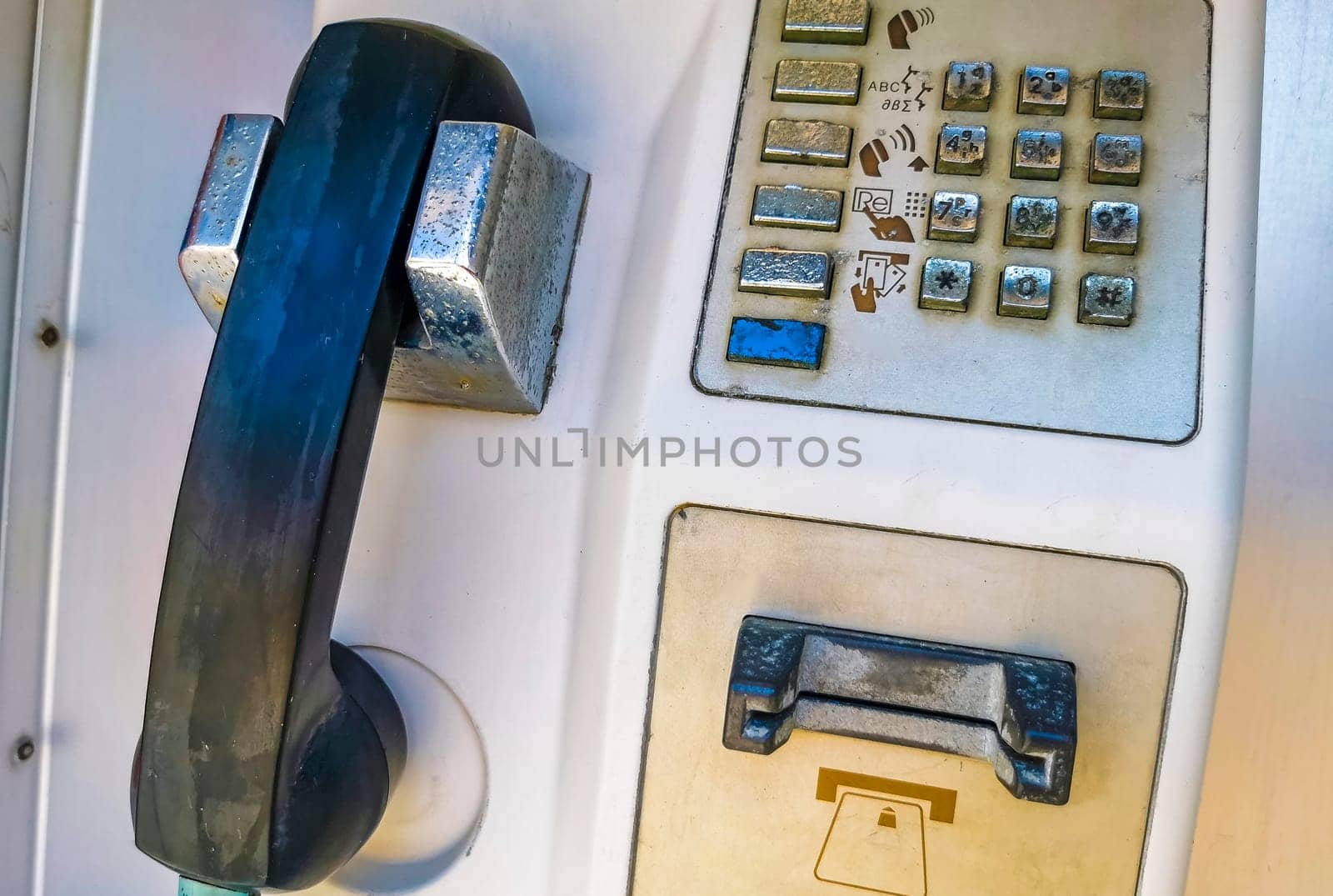 Old telephone box with handset and keypad in Zicatela Puerto Escondido Oaxaca Mexico.