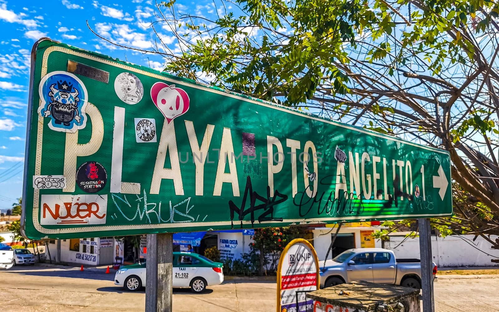 Green Playa Puerto Angelito Beach road street signs and name for orientation of streets and roads in Zicatela Puerto Escondido Oaxaca Mexico.