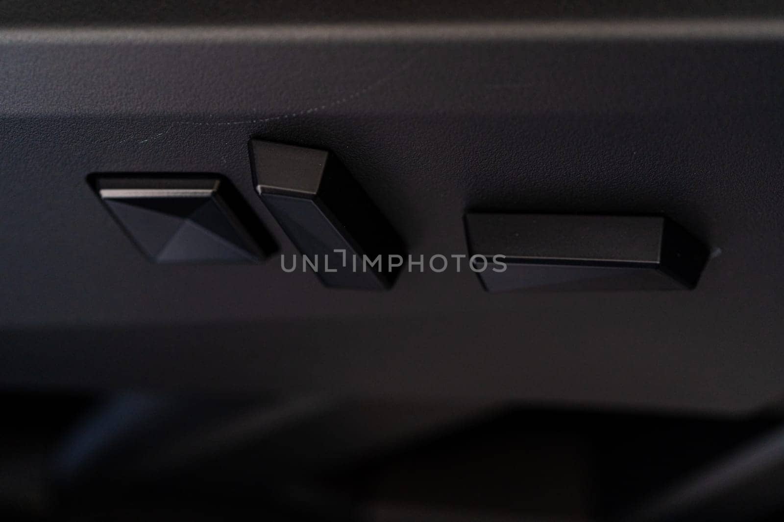 Close-up View of Seat Adjustment Buttons in Tesla Cybertruck by arinahabich