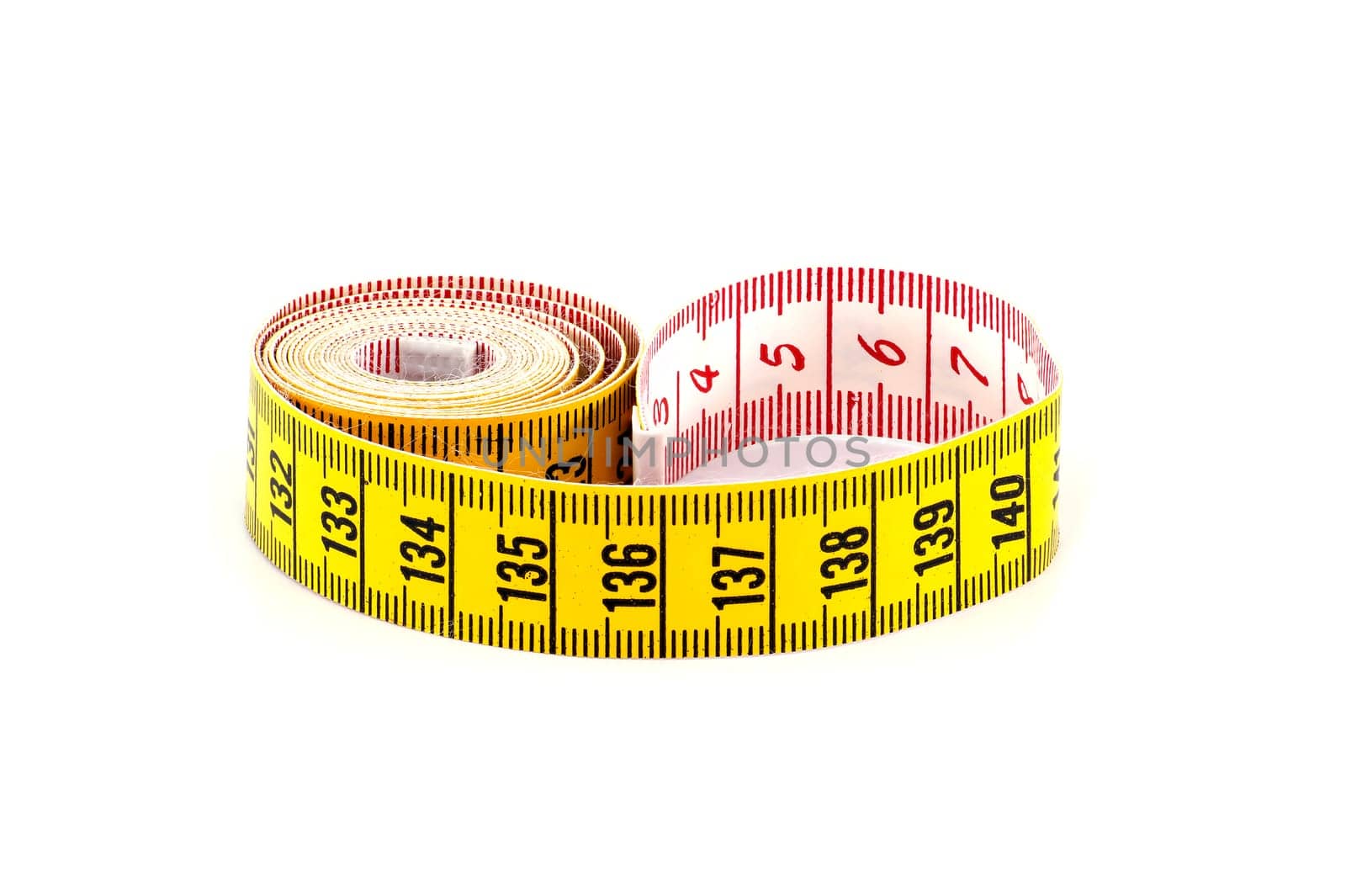 Yellow measuring tape isolated on white background by NetPix