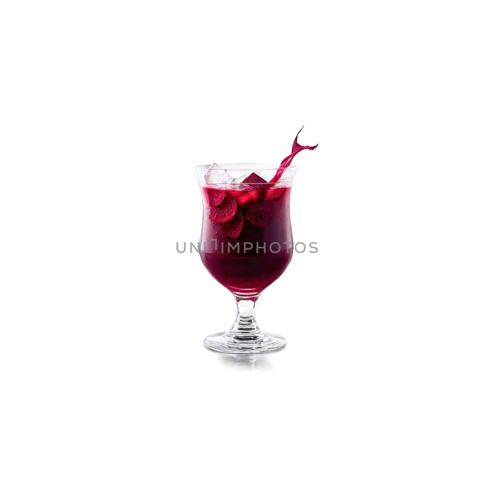 Beet juice with slices of beets and ice cubes twirling in a glass with juice by panophotograph