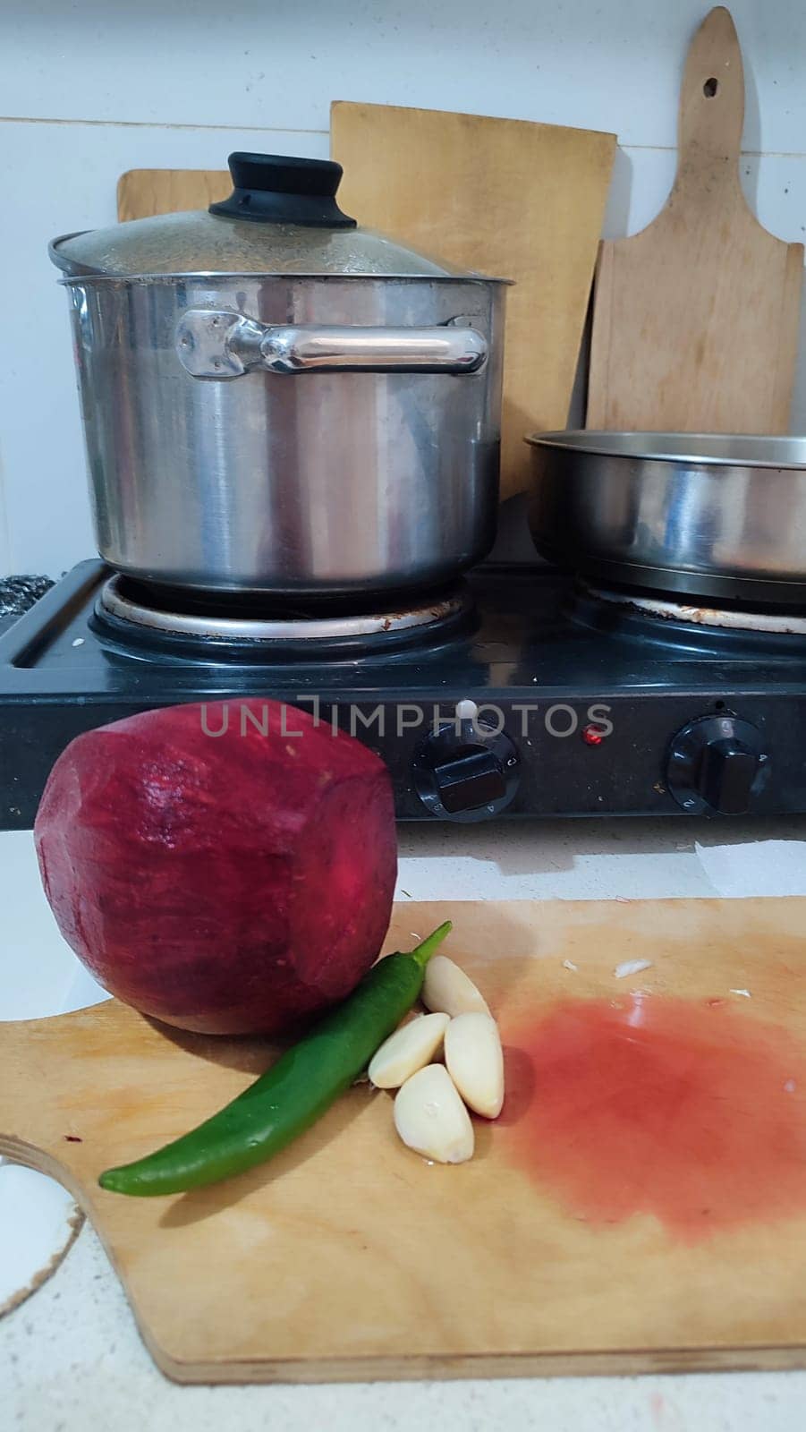 sweet red pepper, beets, garlic, green hot pepper, vegetables food in the kitchen, stove. High quality photo
