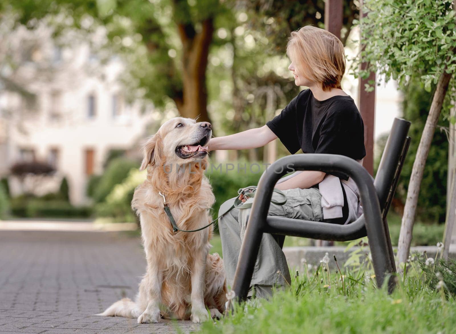 Girl With Golden Retriever On Bench In Spring Is A Heartwarming Sight