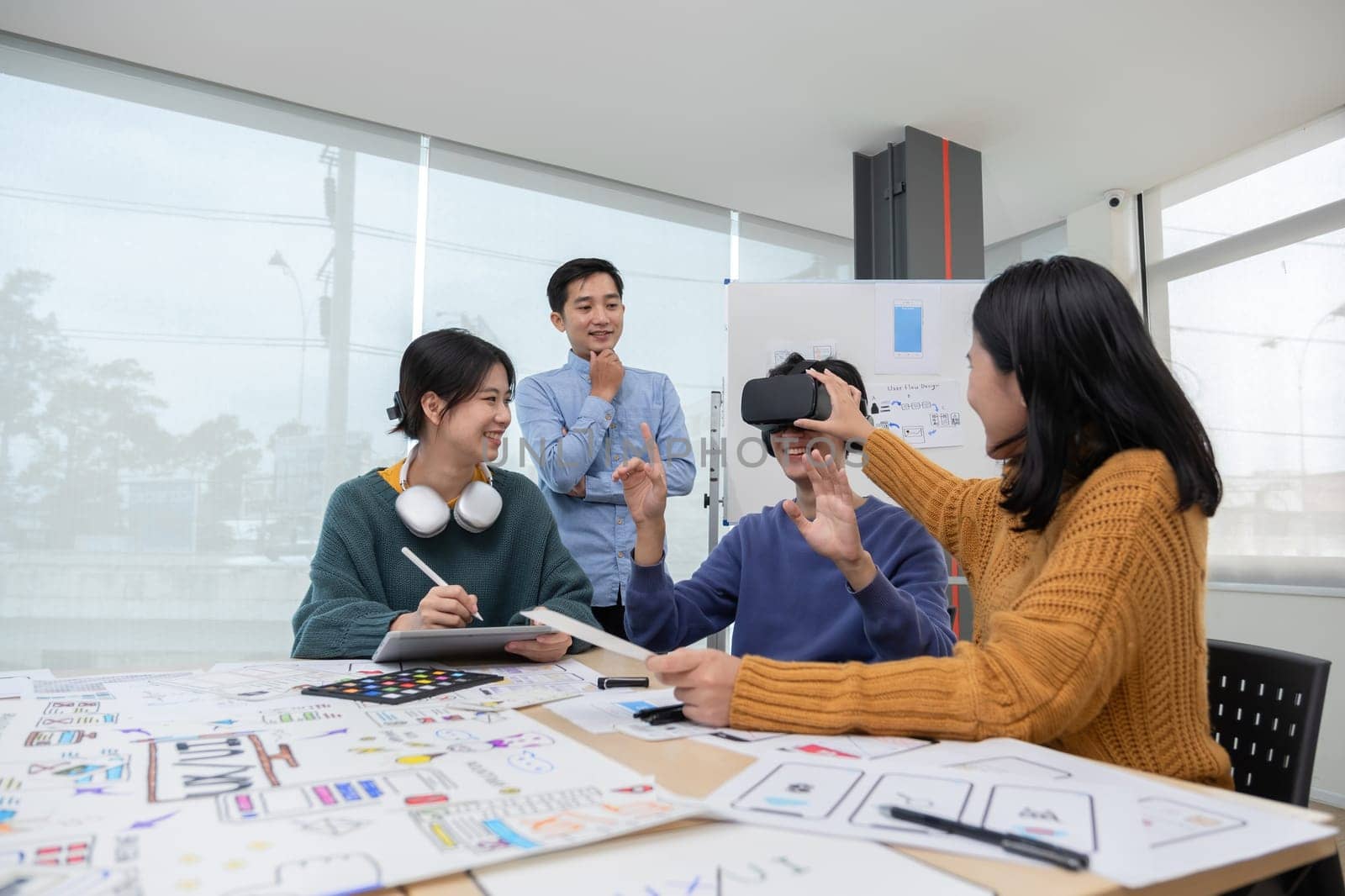 The program developer team held a brainstorming meeting to design and develop software for smart VR glasses that is in the process of updating the system. by wichayada