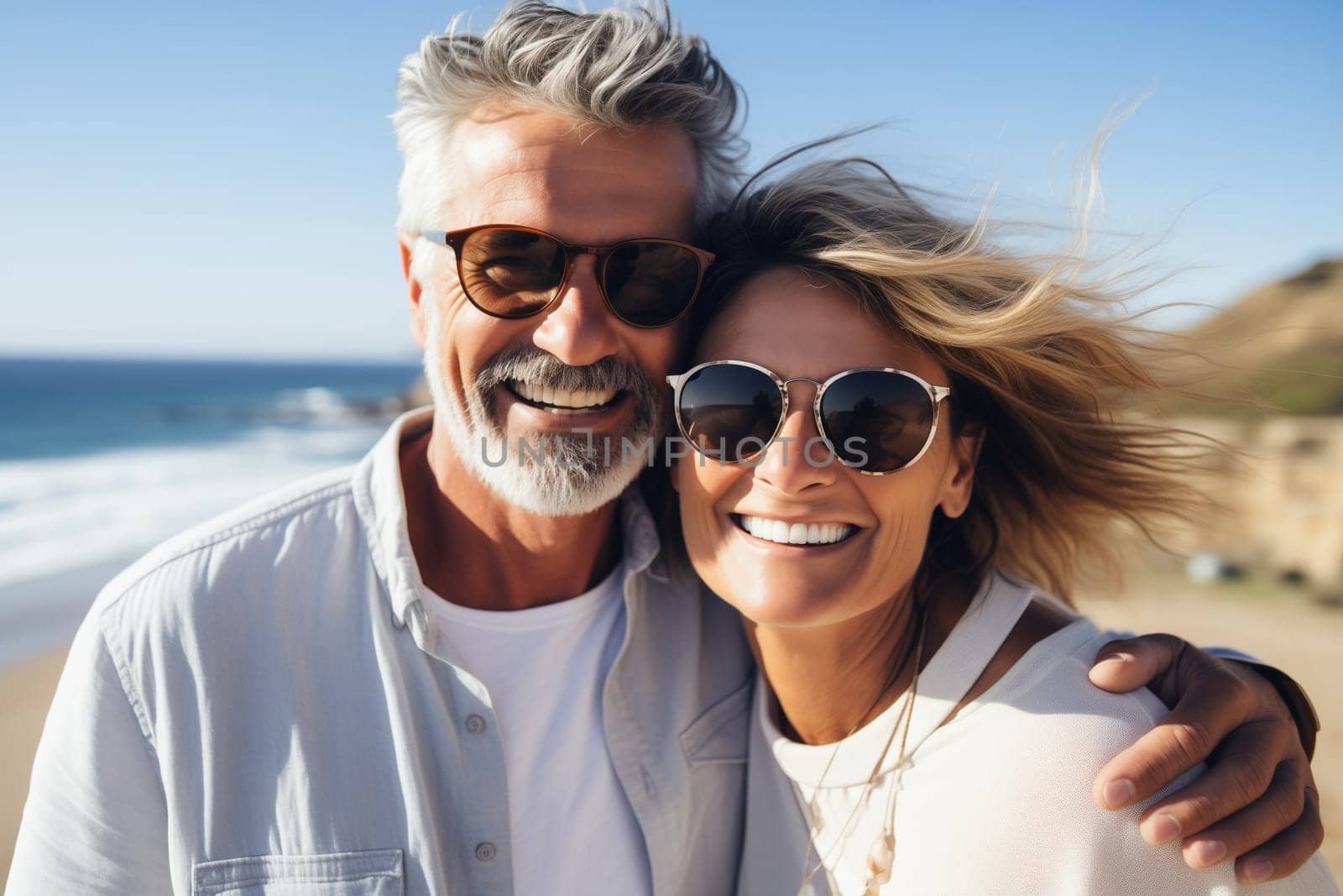 Summer portrait happy smiling mature couple together on sunny coast, enjoying beach vacation at sea by Rohappy