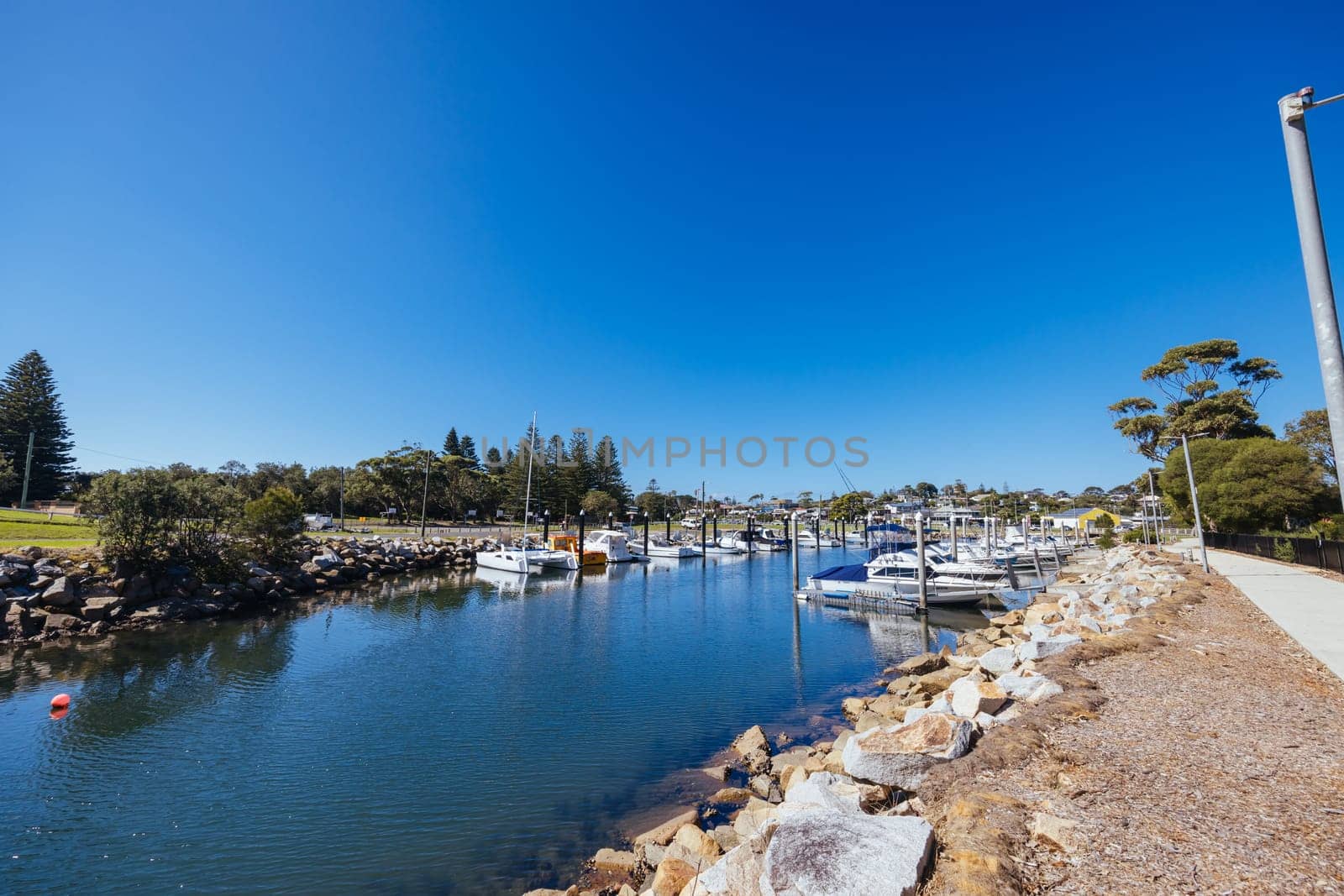 BERMAGUI, AUSTRALIA - April 3 2024: Bermagui Wharf and Marina on the Bermagui River in Bega Shire, New South Wales, Australia