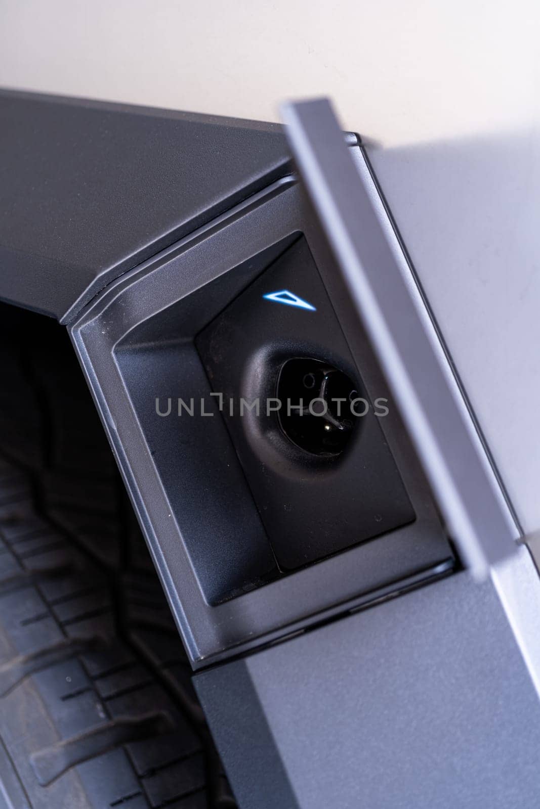 Denver, Colorado, USA-May 5, 2024-This image captures the charging port of the Tesla Cybertruck, showcasing the sleek and functional design that facilitates easy access for electric charging, emphasizing Tesla commitment to sustainable and innovative automotive solutions.