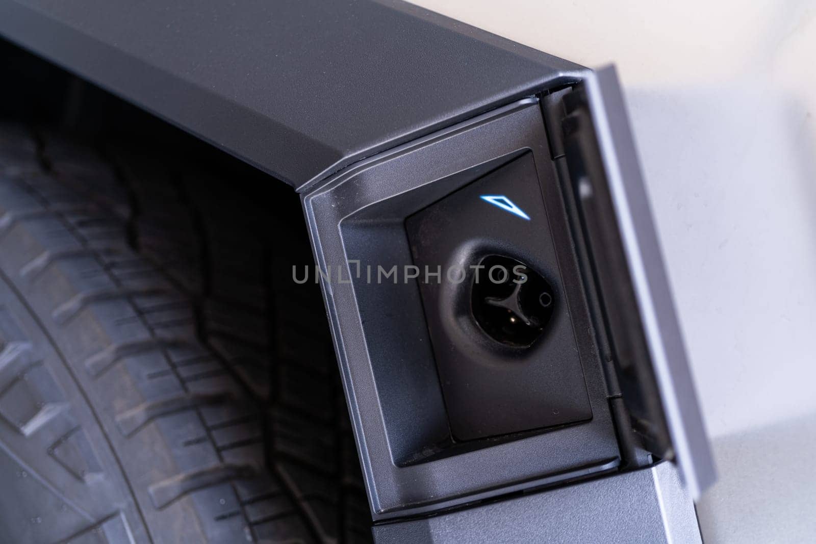 Close-Up of the Charging Port on a Tesla Cybertruck by arinahabich