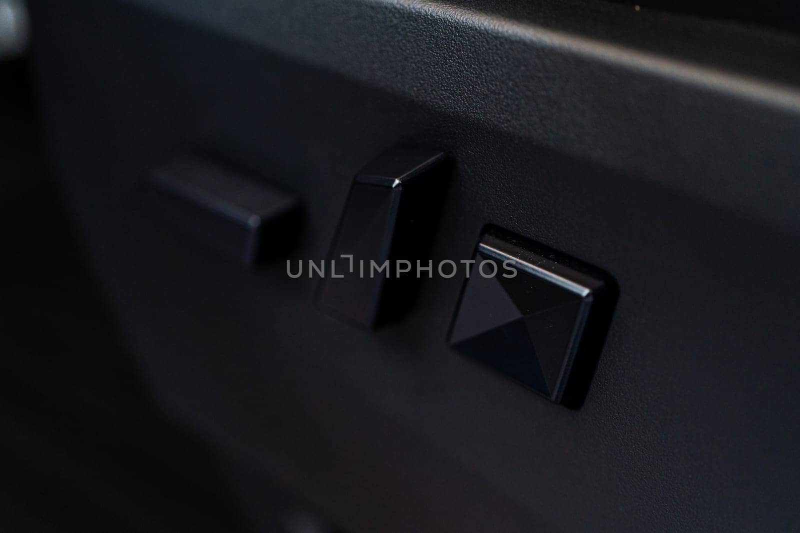 Close-up View of Seat Adjustment Buttons in Tesla Cybertruck by arinahabich