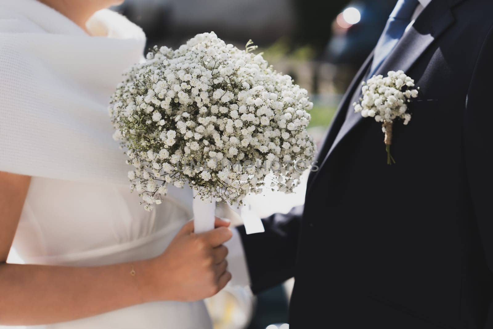 Bridal bouquet and a groom boutonniere of Gypsophila by Godi
